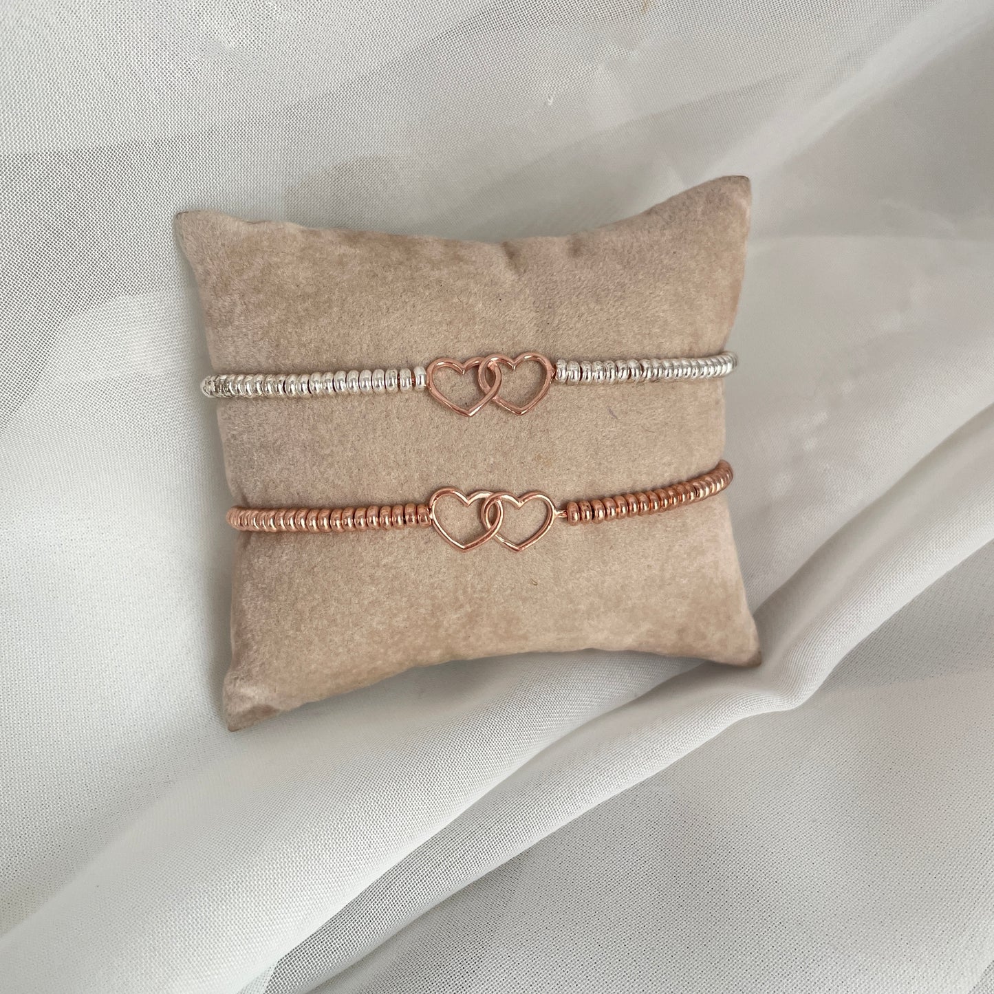 Bracciale in argento o rosè con cuori intrecciati rosé - pezzi unici - Lumiere Bijoux
