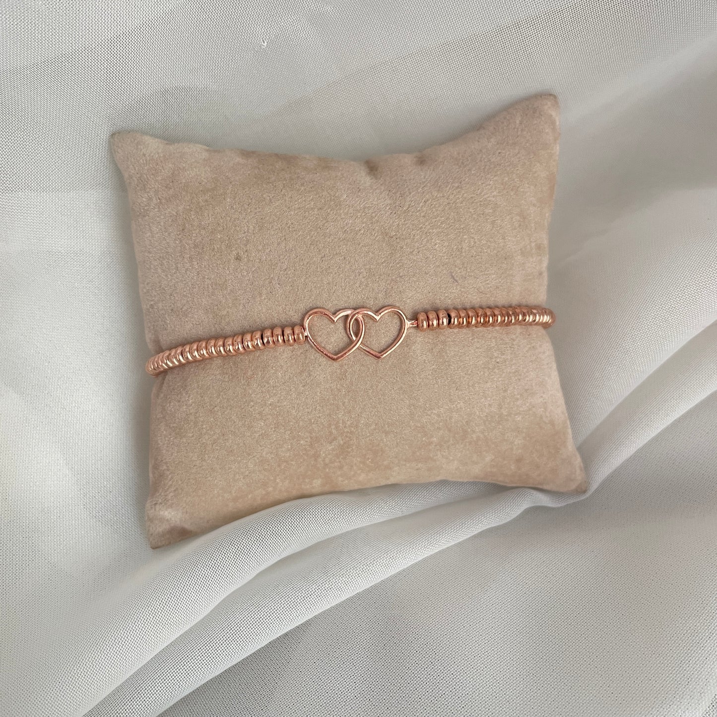 Bracciale in argento o rosè con cuori intrecciati rosé - pezzi unici - Lumiere Bijoux