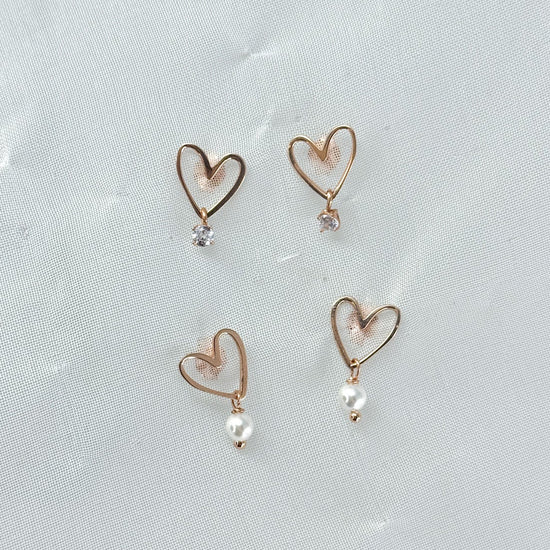 Coppia orecchini cuori vuoti Mykonos da 1 cm rosè con perla o punto luce pendente - Lumiere Bijoux