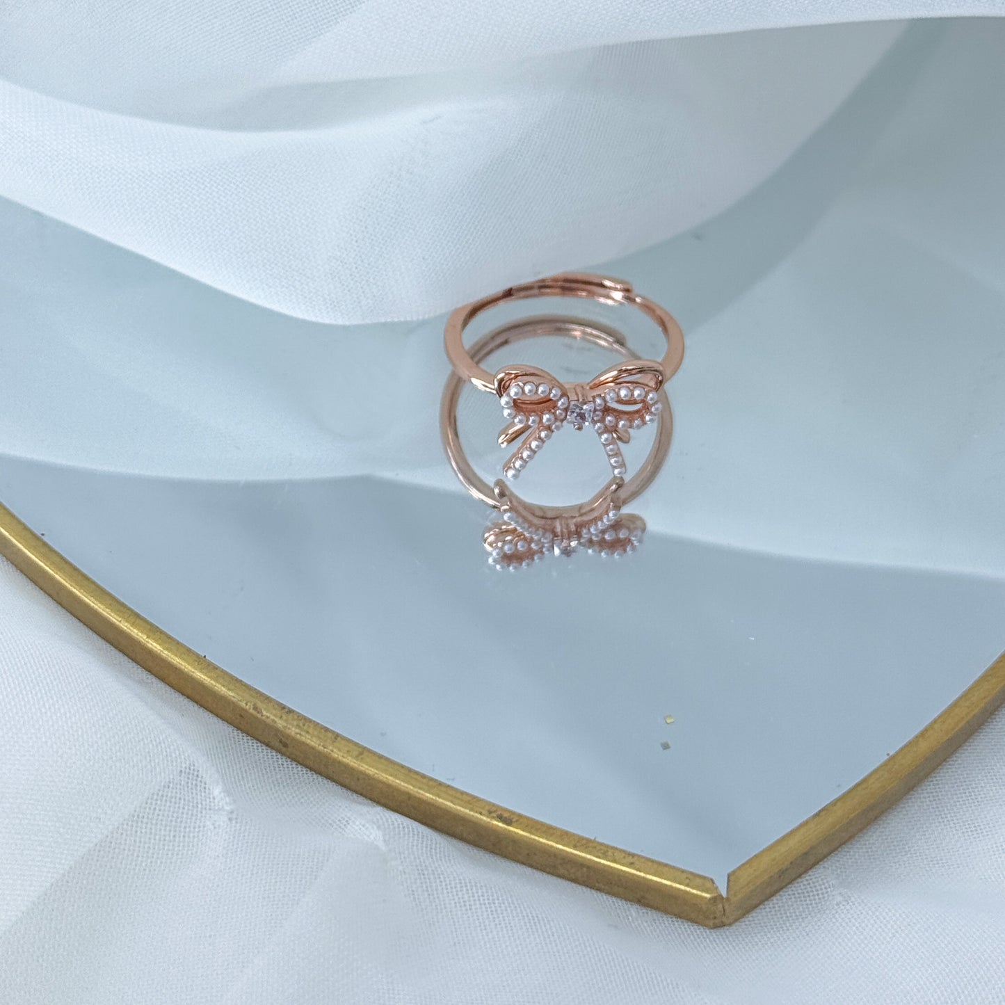 Anello fiocco micro perle e zircone centrale in argento rosé regolabile - Lumiere Bijoux