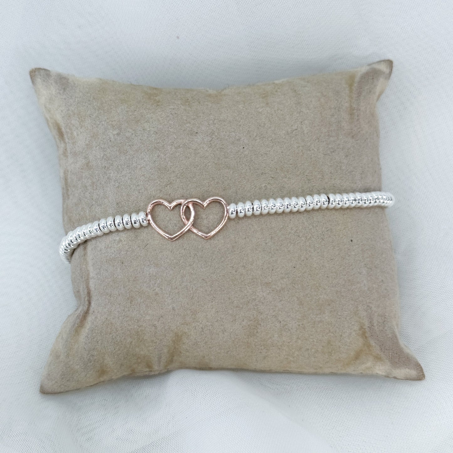 Bracciale in argento con cuori intrecciati rosé - Lumiere Bijoux