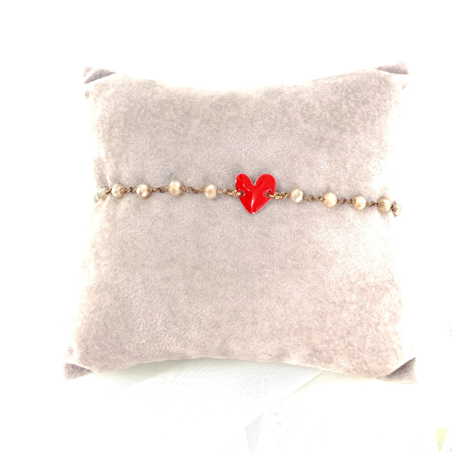 Bracciale cristalli champagne con cuore smaltato rosso in linea