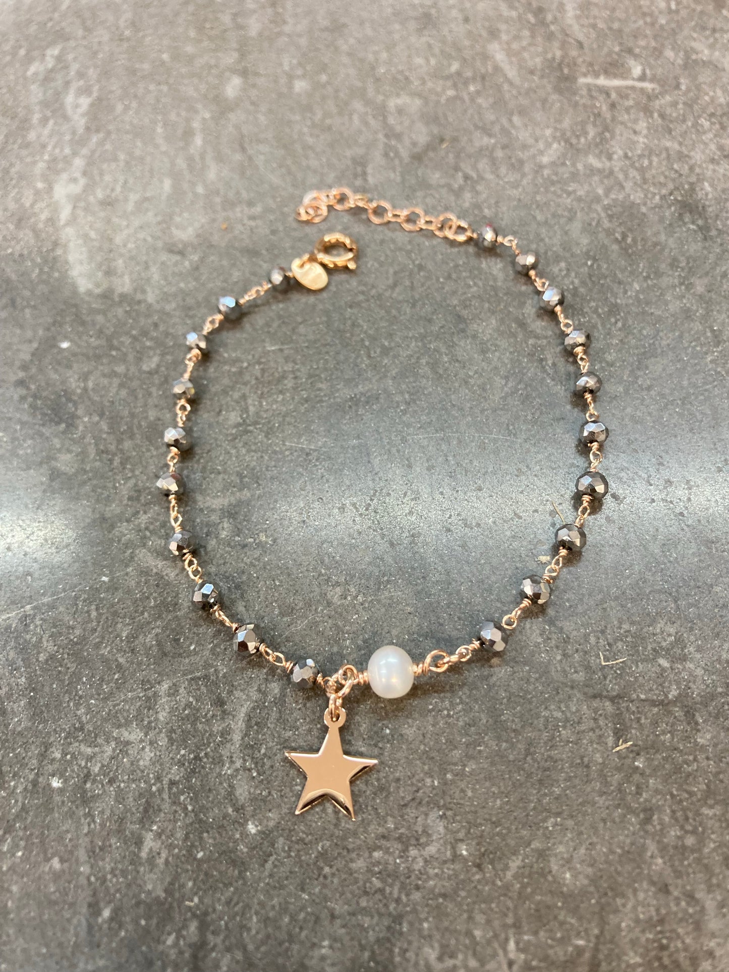 Bracciale cristalli argento con perla in linea e stella pendente